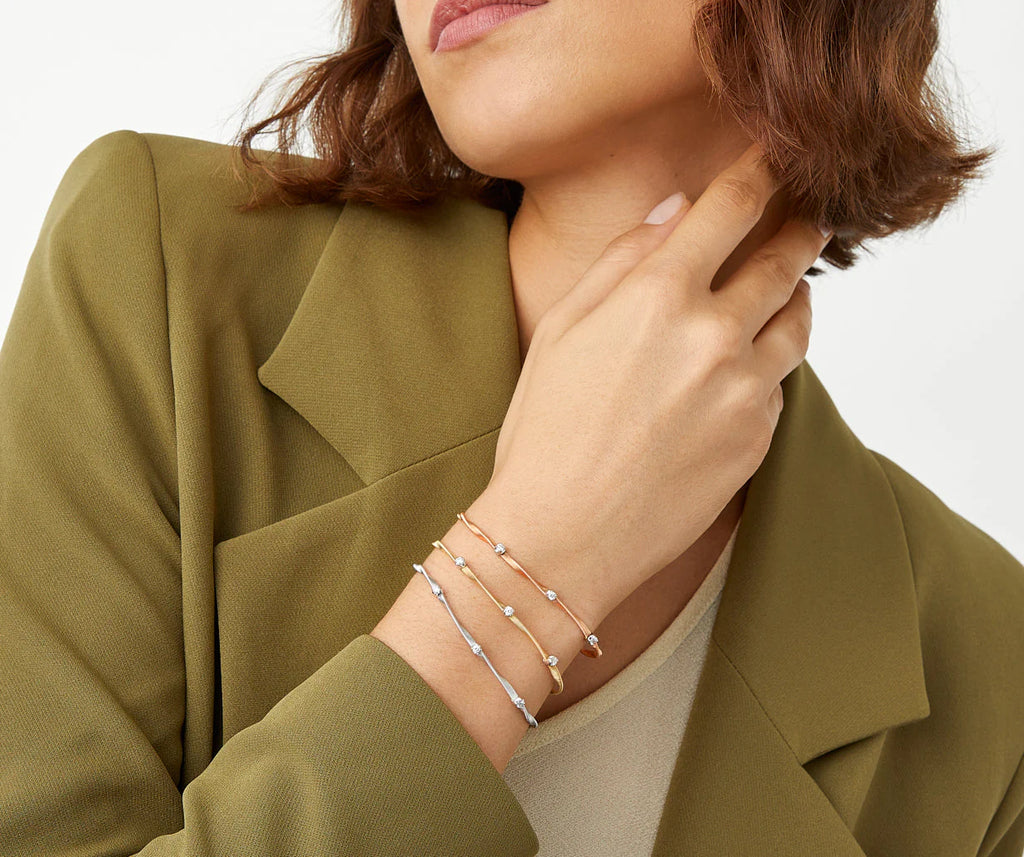 Marrakech Diamond Station Coil Bangle in Yellow Gold